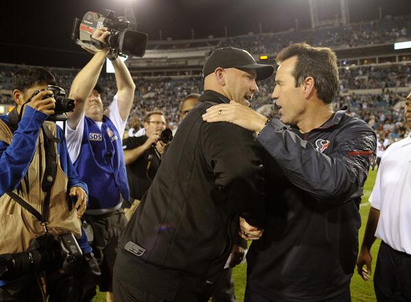 Houston Texans Matt Schaub and head coach Gary Kubiak talk in a