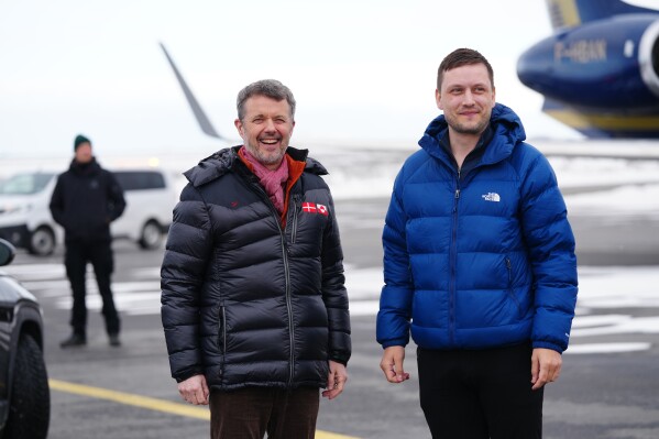 Denmarks King Frederik, left, and Greenland's Prime Minister, Jens-Frederik Nielsen, right, arrive in Nuuk, Greenland, Tuesday, April 29, 2025. (Ida Marie Odgaard/Ritzau Scanpix via AP)