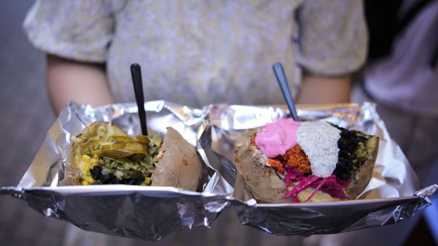 AP PHOTOS: Popular 'kumpir' dish in Turkey is served ahead of International Day of Potato