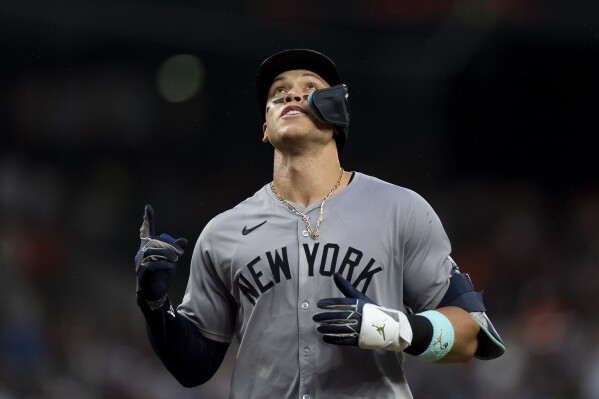 New York Yankees' Aaron Judge celebrates hitting a home run during the third inning of a baseball game against the Baltimore Orioles, Friday, July 12, 2024, in Baltimore. (AP Photo/Stephanie Scarbrough)