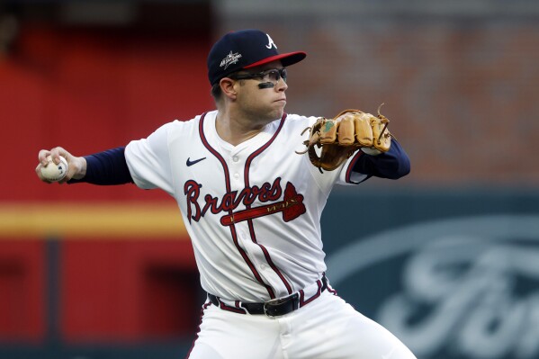 Atlanta Braves shortstop Nick Allen throws to first base for the out on Cincinnati Reds' Santiago Espinal during the second inning of a baseball game, Thursday, May 8, 2025, in Atlanta. (AP Photo/Butch Dill)