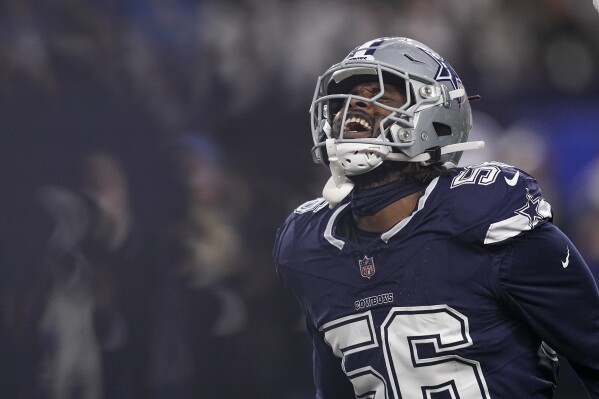 Dallas Cowboys defensive end Dante Fowler Jr. reacts after making a stop on a third down play against the Detroit Lions during the first half of an NFL football game, Saturday, Dec. 30, 2023, in Arlington, Texas. (AP Photo/Sam Hodde, File)