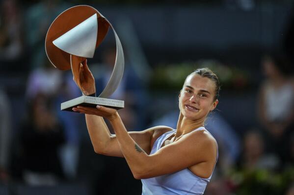 Belarus' Aryna Sabalenka holds the winner's trophy after defeating Iga Swiatek of Poland at the end of the women's final at the Madrid Open tennis tournament in Madrid, Spain, Saturday, May 6, 2023. (AP Photo/Manu Fernandez)