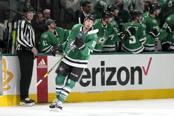 Dallas Stars' Jason Robertson celebrates his goal with the bench in the second period in Game 5 of an NHL hockey Stanley Cup first-round playoff series against the Vegas Golden Knights in Dallas, Wednesday, May 1, 2024. (AP Photo/Tony Gutierrez)