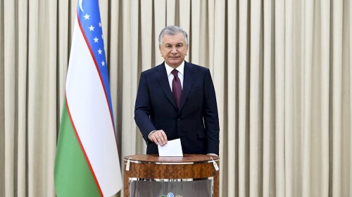 In this handout photo released by Uzbekistan's Presidential Press Office, Uzbekistan's President Shavkat Mirziyoyev casts his ballot at a polling station during a snap presidential election in Tashkent, Uzbekistan, Sunday, July 9, 2023. Uzbekistan is holding a snap presidential election, a vote that follows a constitutional referendum that extended the incumbent's term from five to seven years. President Shavkat Mirziyoyev was elected in 2021 to a second five-year term, the limit allowed by the constitution. (Uzbekistan's Presidential Press Office via AP)