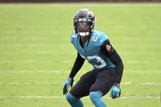 FILE - Jacksonville Jaguars cornerback CJ Henderson (23) follows a play during the second half of an NFL football game against the Houston Texans in Jacksonville, in this Sunday, Nov. 8, 2020, file photo. Henderson hasn't been the same since a shoulder injury last October. New coach Urban Meyer raved about Henderson’s rehab in March and said “we’re counting on him.” But Meyer’s faith in Henderson seems to be waning. (AP Photo/Phelan M. Ebenhack, File)