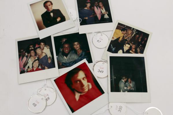 This Jan. 16, 2013 photo shows various polaroids shot by Andy Warhol at Studio 54 on display in West Palm Beach, Fla. Memorabilia from the famed 1970s club is hitting the auction block in Florida. The private collection of co-founder Steve Rubell is being sold Saturday in West Palm Beach. (AP Photo/Alan Diaz)