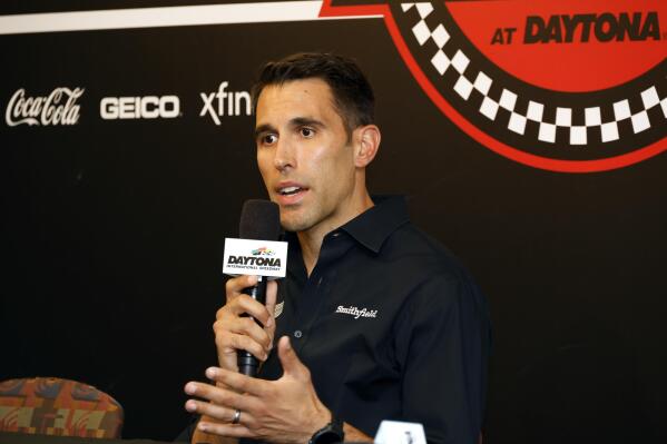 Aric Almirola answers a question from a reporter during a media availability before a NASCAR Cup Series auto race at Daytona International Speedway, Friday, Aug. 26, 2022, in Daytona Beach, Fla. (AP Photo/Terry Renna)