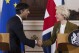 FILE - Britain's Prime Minister Rishi Sunak and EU Commission President Ursula von der Leyen, right, shake hands after a press conference at Windsor Guildhall, Windsor, England, Monday Feb. 27, 2023. Britain is rejoining the European Union’s science-sharing program Horizon Europe. The news announced Thursday, Sept. 7, 2023 comes more than two years after Britain's membership became a casualty of Brexit.(Dan Kitwood/Pool via AP, File)