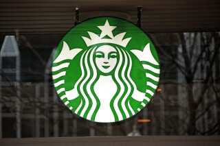 FILE - This Thursday, Jan. 12, 2017, file photo shows a Starbucks logo sign in the window of one of the chain's cafes in Pittsburgh. Starbucks reports their earnings on Tuesday, Jan. 30, 2024. (AP Photo/Gene J. Puskar, File)