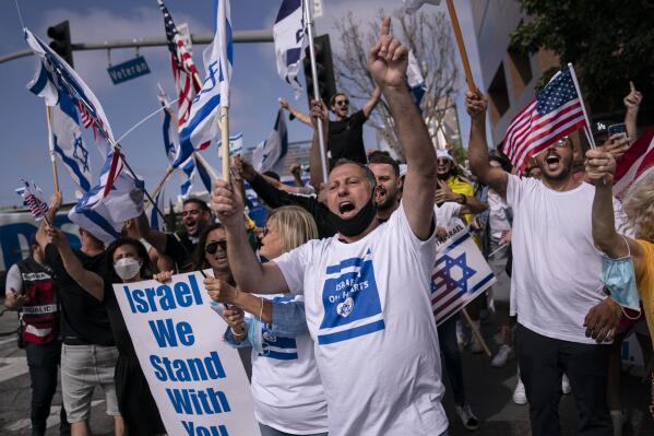 FILE - Pro-Israel supporters chant slogans during a rally in support of Israel outside the Federal Building in Los Angeles, Wednesday, May 12, 2021. A larger debate is playing out nationwide among many U.S. Jews who are divided over how to respond to the violence and over the disputed boundaries for acceptable criticism of Israeli policies. (AP Photo/Jae C. Hong, file)