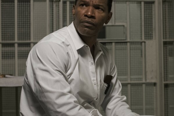 This image released by Warner Bros Pictures shows Jamie Foxx in a scene from "Just Mercy." The 2019 film, which chronicles courtroom struggles against racial injustice and mass incarceration, will be made free on digital platforms in the wake of George Floyd’s death.  (Jake Netter/Warner Bros. Pictures via AP)