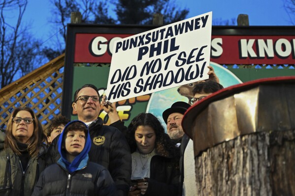 Pennsylvania Gov. Josh Shapiro watches Punxsutawney Phil, the weather prognosticating groundhog, during the 138th celebration of Groundhog Day on Gobbler's Knob in Punxsutawney, Pa., Friday, Feb. 2, 2024. Phil's handlers said that the groundhog has forecast an early spring. (APPhoto/Barry Reeger)