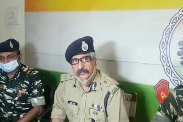 Ashok Juneja, the Inspector General for anti-Maoist operations, right, addresses the media in Raipur, India, Sunday, April 4, 2021.  India on Sunday recovered the bodies of 20 police and paramilitary troops who were killed in a gunbattle with Maoist rebels a day earlier in the forests of the eastern Chhattisgarh state. (AP Photo)