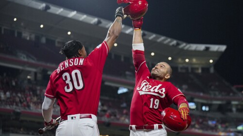 Cincinnati Reds' Joey Votto, right, celebrates with Will Benson after hitting a two-run home run against the San Francisco Giants during the seventh inning of a baseball game in Cincinnati, Tuesday, July 18, 2023. (AP Photo/Aaron Doster)