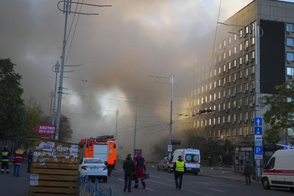 FILE- Smoke rises after a drone fired on buildings in Kyiv, Ukraine, Monday, Oct. 17, 2022. Surovikin has become the face of Russia’s new strategy in Ukraine, which includes unleashing a barrage of strikes against the country's infrastructure. (AP Photo/Efrem Lukatsky, File)