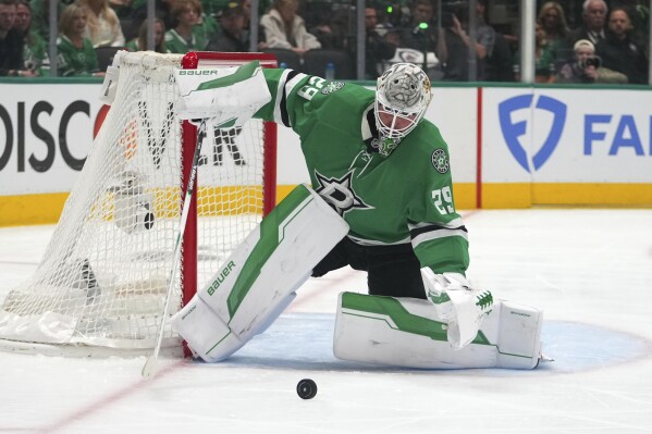 Dallas Stars' Jake Oettinger defends against a shot from the Winnipeg Jets in the second period of Game 3 of a second-round NHL hockey playoff series in Dallas, Sunday, May 11, 2025. (AP Photo/Julio Cortez)