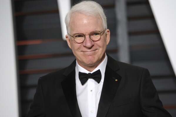 FILE - Steve Martin arrives at the 2015 Vanity Fair Oscar Party on Sunday, Feb. 22, 2015, in Beverly Hills, Calif. Martin is the subject of a new documentary "Steve! (Martin) a Documentary in 2 Pieces." (Photo by Evan Agostini/Invision/AP, File)
