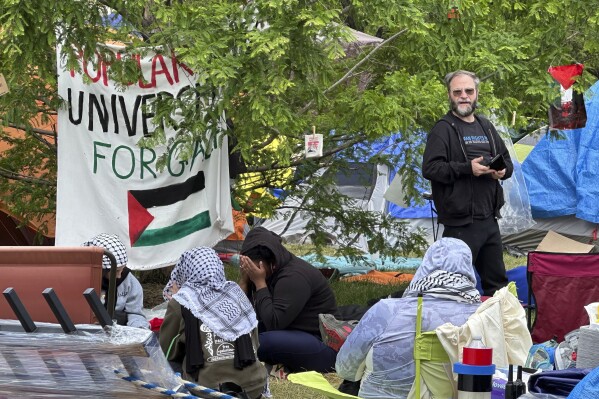 A pro-Palestinian encampment is shown Tuesday, May 28, 2024, on the campus of Wayne State University in Detroit. The school suspended in-person classes and encouraged staff to work remotely to avoid any problems with the encampment. (AP Photo/Mike Householder)