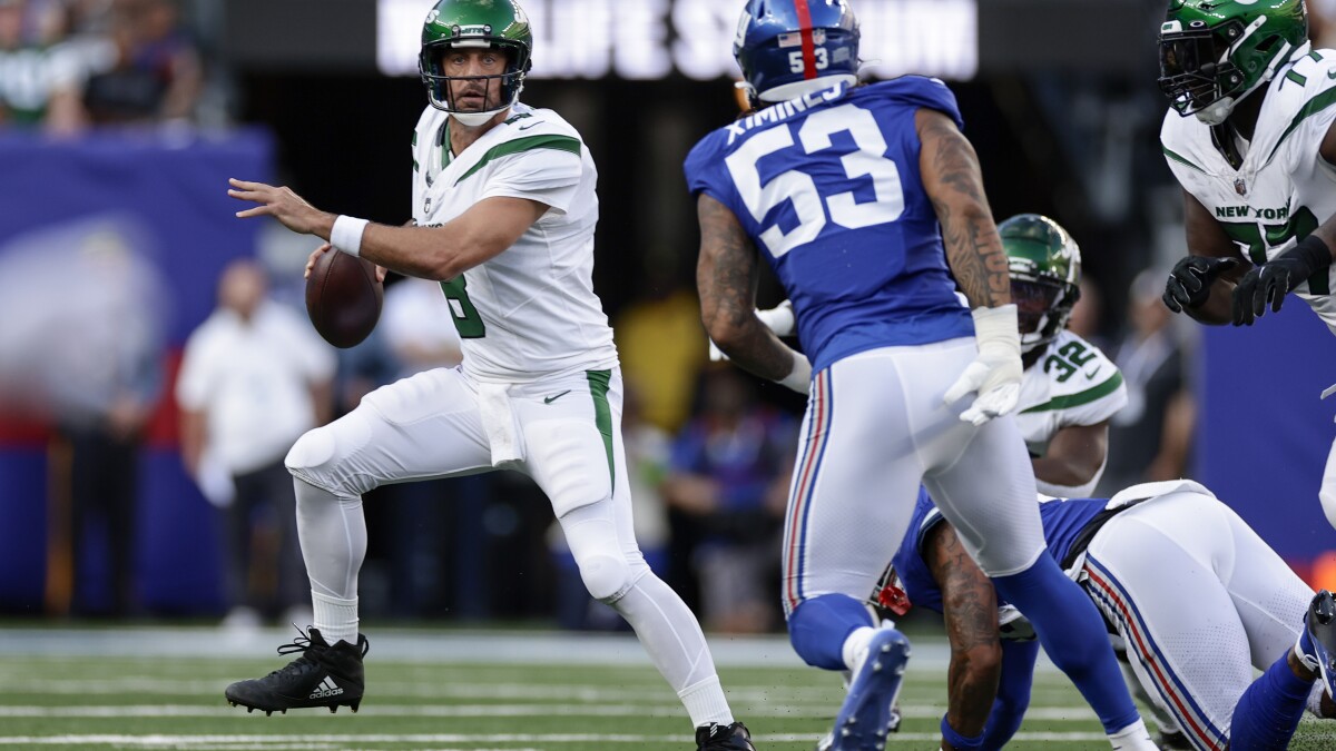 Green Bay Packers quarterback Aaron Rodgers (12) looks to throw a pass  against the Philadelphia Eagles during an NFL football game, Thursday,  Sept. 26, 2019, in Green Bay, Wis. The Eagles defeated