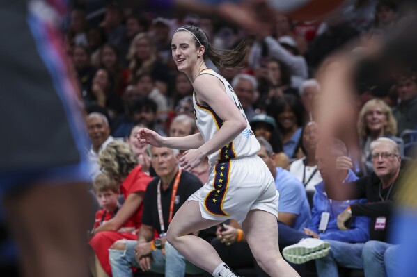 Indiana Fever guard Caitlin Clark reacts after making a three-pointer in the first half of an WNBA basketball game against the Atlanta Dream, Thursday, May, 22, 2025, in Atlanta. (AP Photo/Colin Hubbard)