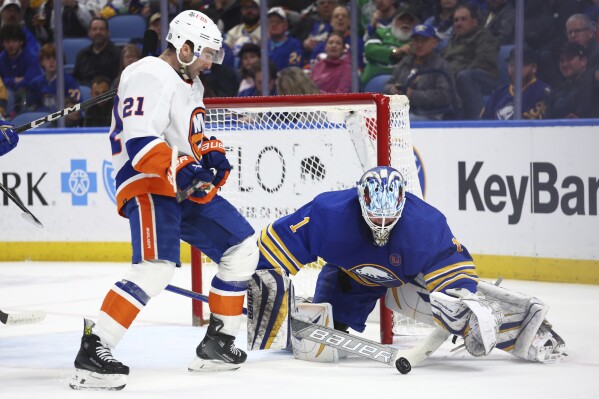 New York Islanders center Kyle Palmieri (21) is stopped by Buffalo Sabres goaltender Ukko-Pekka Luukkonen (1) during the second period of an NHL hockey game Thursday, March 14, 2024, in Buffalo, N.Y. (AP Photo/Jeffrey T. Barnes)