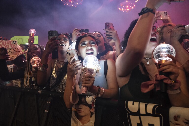 Festival-goers are seen during the first weekend of the Coachella Valley Music and Arts Festival at the Empire Polo Club, Friday, April 12, 2024, in Indio, Calif. (Photo by Amy Harris/Invision/AP)