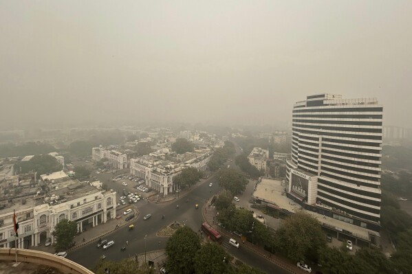 Smog hangs over the city skyline in New Delhi, India, Friday, Nov. 3, 2023. Authorities on Friday shut primary schools and banned polluting vehicles and construction activity to control the worst haze and smog this season, causing respiratory infections among people and enveloping monuments and high-rise buildings in and around New Delhi. (AP Photo/Shonal Ganguly)
