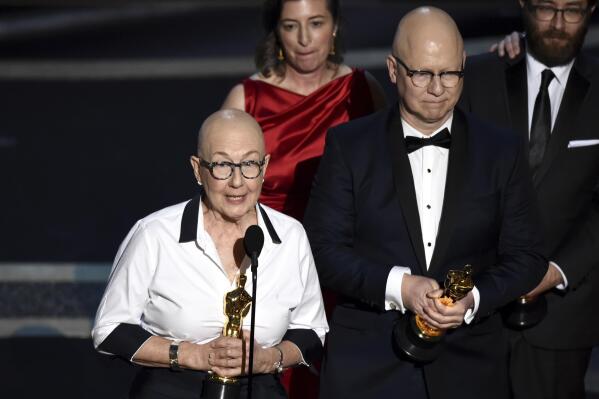 FILE - Julia Reichert, left, and Steven Bognar accept the award for best documentary feature for "American Factory" at the Oscars in Los Angeles on Feb. 9, 2020. Reichert, the Oscar-winning documentary filmmaker whose films explored themes of race, class and gender, often in the Midwest, died Thursday in Ohio from cancer, her family said Friday through a representative. She was 76. (AP Photo/Chris Pizzello, File)