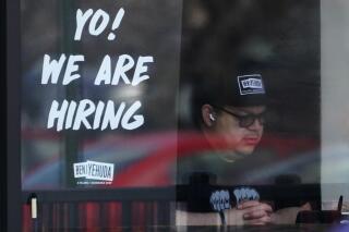 A hiring sign is displayed at a restaurant in Schaumburg, Ill., Friday, April 1, 2022. More Americans applied for unemployment benefits last week, and while layoffs remain low, it's the fifth straight week claims have topped the 230,000 mark. Applications for jobless aid for the week ending July 2 rose to 235,000, up 4,000 from the previous week, the Labor Department reported Thursday, July 7. (AP Photo/Nam Y. Huh, File)