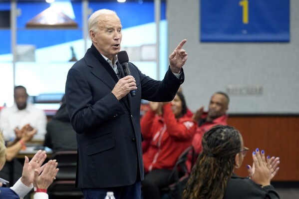 FILE - President Joe Biden meets with UAW members during a campaign stop at a phone bank in the UAW Region 1 Union Hall, Feb. 1, 2024, in Warren, Mich. Biden is dispatching several senior aides to Michigan to meet with Arab American and Muslim leaders as the administration鈥檚 handling of the Israel-Hamas war continues to frustrate members of a key constituency in a 2024 battleground state. That's according to three people familiar with the matter. (AP Photo/Evan Vucci, File)