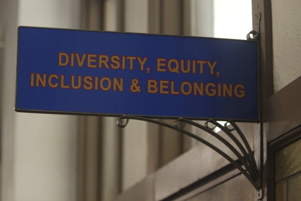 This photo from Friday, April 12, 2024, shows the sign above the door to the Office of Diversity, Equity, Inclusion and Belonging inside the main administration building on the main University of Kansas campus in Lawrence, Kan. Republican lawmakers across the U.S. are seeking to restrict diversity initiatives on colleges campuses, arguing that they enforce a liberal orthodoxy. (AP Photo/John Hanna)