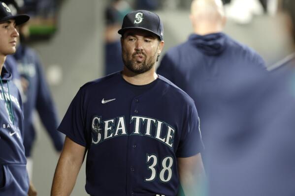 Seattle Mariners starting pitcher Robbie Raywals walks through the dugout after he was pulled from the game during the sixth inning of a baseball game against the Texas Rangers, Tuesday, Sept. 27, 2022, in Seattle. (AP Photo/John Froschauer)