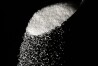 FILE - Granulated sugar is poured using a spoon, Sept. 12, 2016, in Philadelphia. New York City residents may soon see warning labels next to sugary foods and drinks in chain restaurants and coffee shops, under a law set to go into effect later in 2024. (AP Photo/Matt Rourke, File)