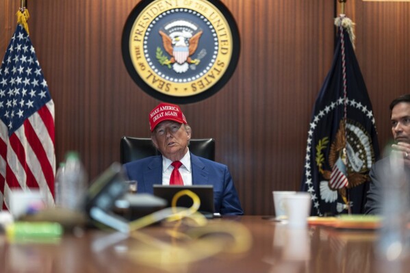 In this image provided by the White House, President Donald Trump and Secretary of State Marco Rubio, right, sit in the Situation Room, Saturday, June 21, 2025, at the White House in Washington. (The White House via AP)