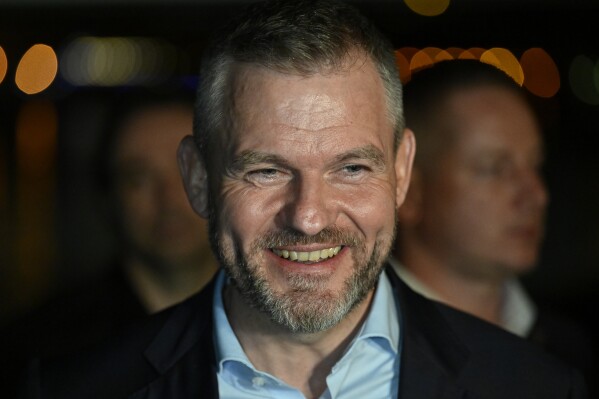 Presidential candidate Peter Pellegrini smiles at his headquarters after a presidential runoff in Bratislava, Slovakia, Saturday, April 6, 2024. Pellegrini is a close ally of populist Prime Minister Robert Fico known for his pro-Russian policies. (AP Photo/Denes Erdos)