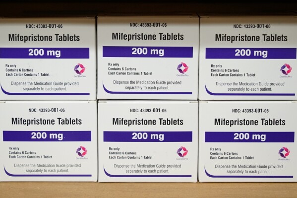 FILE - Boxes of the drug mifepristone sit on a shelf at the West Alabama Women's Center in Tuscaloosa, Ala., on March 16, 2022. The Supreme Court will again wade into the fractious issue of abortion when it hears arguments Tuesday, March 26, 2024, over mifepristone, a medication used in the most common way to end a pregnancy, for a case with profound implications for millions of women no matter where they live in America and, perhaps, the race for the White House. (AP Photo/Allen G. Breed, File)