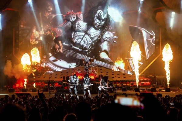 FILE - Gene Simmons, from left, Eric Singer, Paul Stanley and Tommy Thayer of KISS perform at the Riverbend Music Center in Cincinnati on Aug. 29, 2019. The band's final two shows are scheduled for Dec. 1 and 2 at Madison Square Garden in New York. (Photo by Amy Harris/Invision/AP, File)
