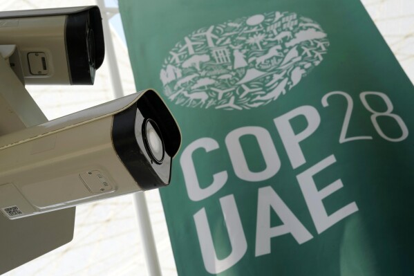 G42 cameras are visible at the COP28 U.N. Climate Summit, Saturday, Dec. 9, 2023, in Dubai, United Arab Emirates. (AP Photo/Peter Dejong)