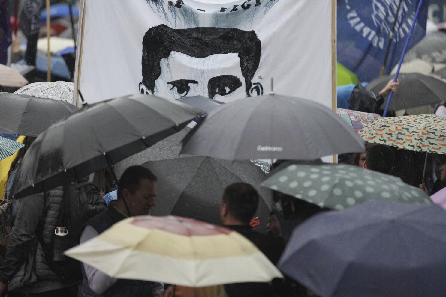 Thousands brave heavy rain to protest Serbia's crackdown on universities