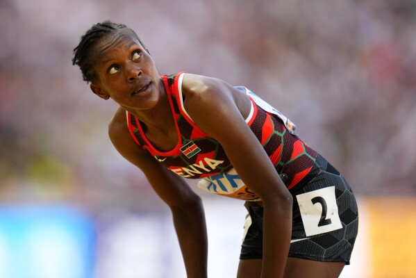 Foto de Full length of African American female athlete at starting block on  race track do Stock