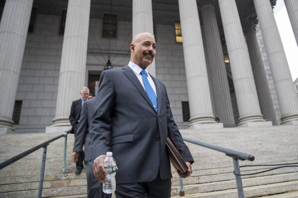 Ted Wells, Jr., the lead attorney for Exxon, leaves Manhattan Supreme court after opening arguments in a lawsuit against Exxon, Tuesday, Oct. 22, 2019, in New York. The lawsuit brought on by New York's attorney general, claims the Texas energy giant kept two sets of books — one accounting for climate change regulations and the other underestimating the costs — to make the company appear more valuable to investors. (AP Photo/Mary Altaffer)