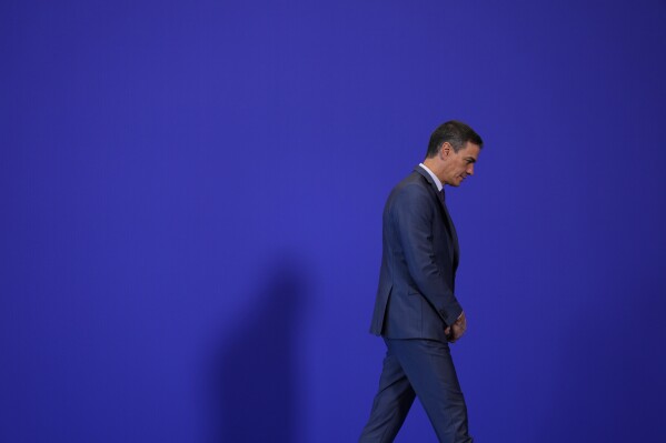 FILE - Spain's Prime Minister Pedro Sanchez walks at the Europe Summit in Granada, Spain, Oct. 6, 2023. Socialist Prime Minister Pedro Sanchez has left Spain in suspense on announcing he may step down because of what he called an 