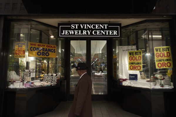 A pedestrian walks past the St. Vincent Jewelry Center in the Jewelry District of Los Angeles, Friday, May 2, 2025. (AP Photo/Jae C. Hong)