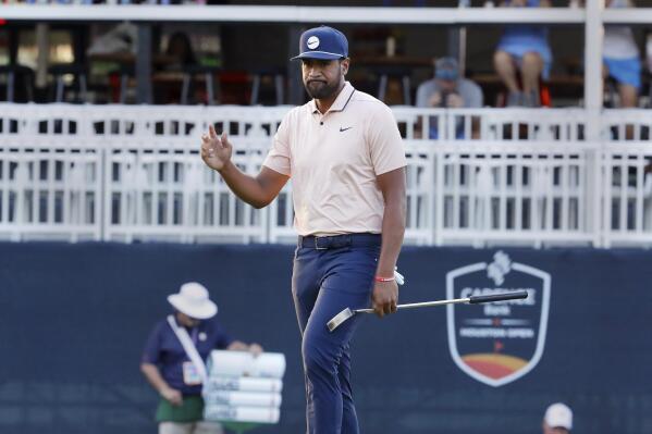 Tony Finau acknowledges the gallery after sinking his last putt of the day on the ninth green, putting him at 5 under during the first round of the Houston Open golf tournament Thursday, Nov. 10, 2022, in Houston. (AP Photo/Michael Wyke)