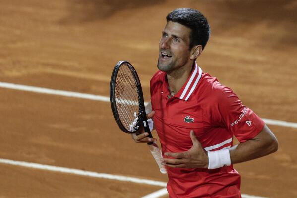 FILE - Serbia's Novak Djokovic celebrates after defeating Italy's Lorenzo Sonego in their semifinal match at the Italian Open tennis tournament, in Rome, May 15, 2021. Djokovic won 6-3 6-7 6-2 and will play Rafael Nadal in the final. Novak Djokovic is ready to move on from the controversy surrounding his refusal to get vaccinated against COVID-19.
“I miss competition,” the Serbian tennis star said Sunday April 10, 2022, on the opening day of the clay-court season at the Monte Carlo Masters in Monaco. (AP Photo/Gregorio Borgia, File)