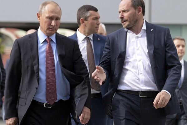 FILE - In this file photo taken on Sept. 21, 2017, Russian President Vladimir Putin, left, listens to Yandex CEO Arkady Volozh, right, during his visits Russia's largest internet search engine Yandex headquarters in Moscow, Russia. Volozh has been one of Russia's wealthy businessmen to have condemned Moscow's invasion of Ukraine as "barbaric,' but he has remained on the European Union's sanctions list. (Alexei Druzhinin, Sputnik, Kremlin Pool Photo via AP, File)