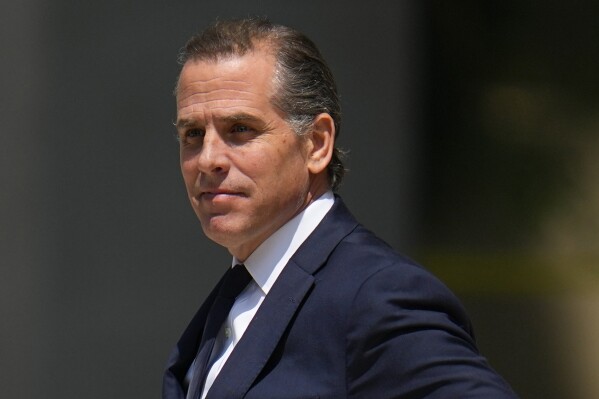 FILE - President Joe Biden's son Hunter Biden leaves after a court appearance, July 26, 2023, in Wilmington, Del. Hunter Biden has filed a lawsuit against the Internal Revenue Service, arguing that two agents violated his right to privacy when they publicly aired his tax information as they pressed claims that a federal investigation into him had been improperly handled. The lawsuit filed Monday says that his personal tax details shared during congressional hearings and interviews was not allowed by whistleblower protections. (AP Photo/Julio Cortez, File)