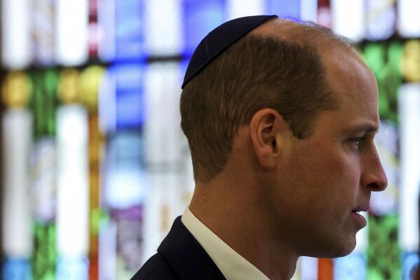 Britain's Prince William, the Prince of Wales wears a kippah as he visits the Western Marble Arch Synagogue in London, Thursday, Feb. 29, 2024. (Toby Melville/Pool Photo via AP)