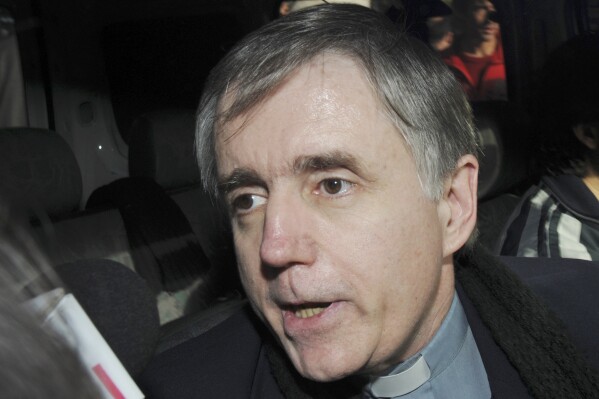 Argentine Catholic priest Julio Grassi talks to reporters as he leaves a courthouse in the outskirts of Buenos Aires, June 10, 2009. (AP Photo/Rolando Andrade Stracuzzi, File)